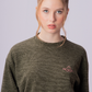Detalhe da blusa manga longa do Full Look Cozy Green em verde cozy.