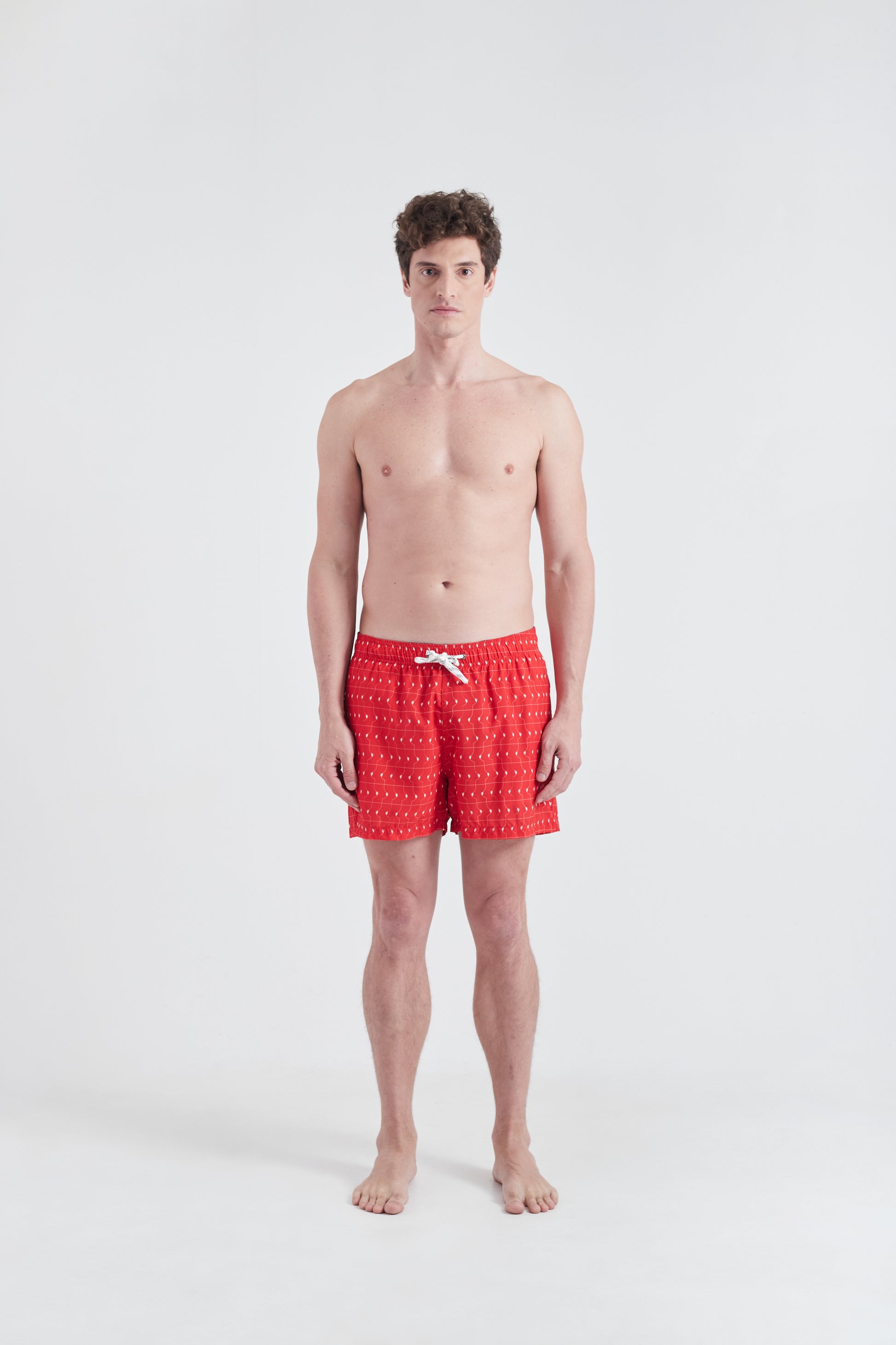 Shorts Boobie Trap Design estampado sobre tons Vermelho e branco distribuidos unifomemente por todo o tecido. Peça prática e confortavel.