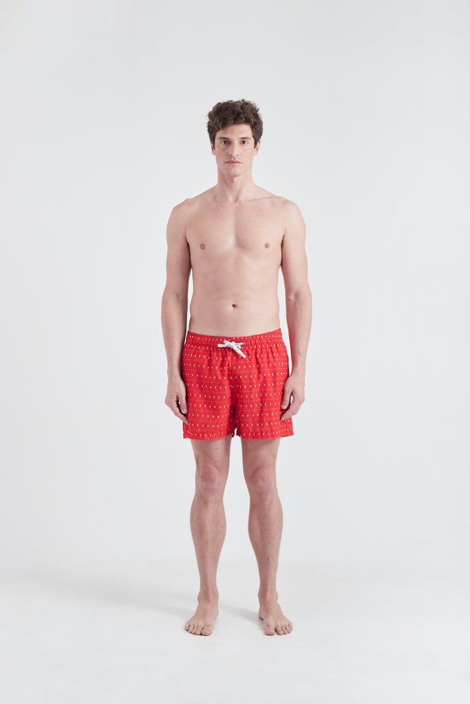 Shorts Boobie Trap Design estampado sobre tons Vermelho e branco distribuidos unifomemente por todo o tecido. Peça prática e confortavel.